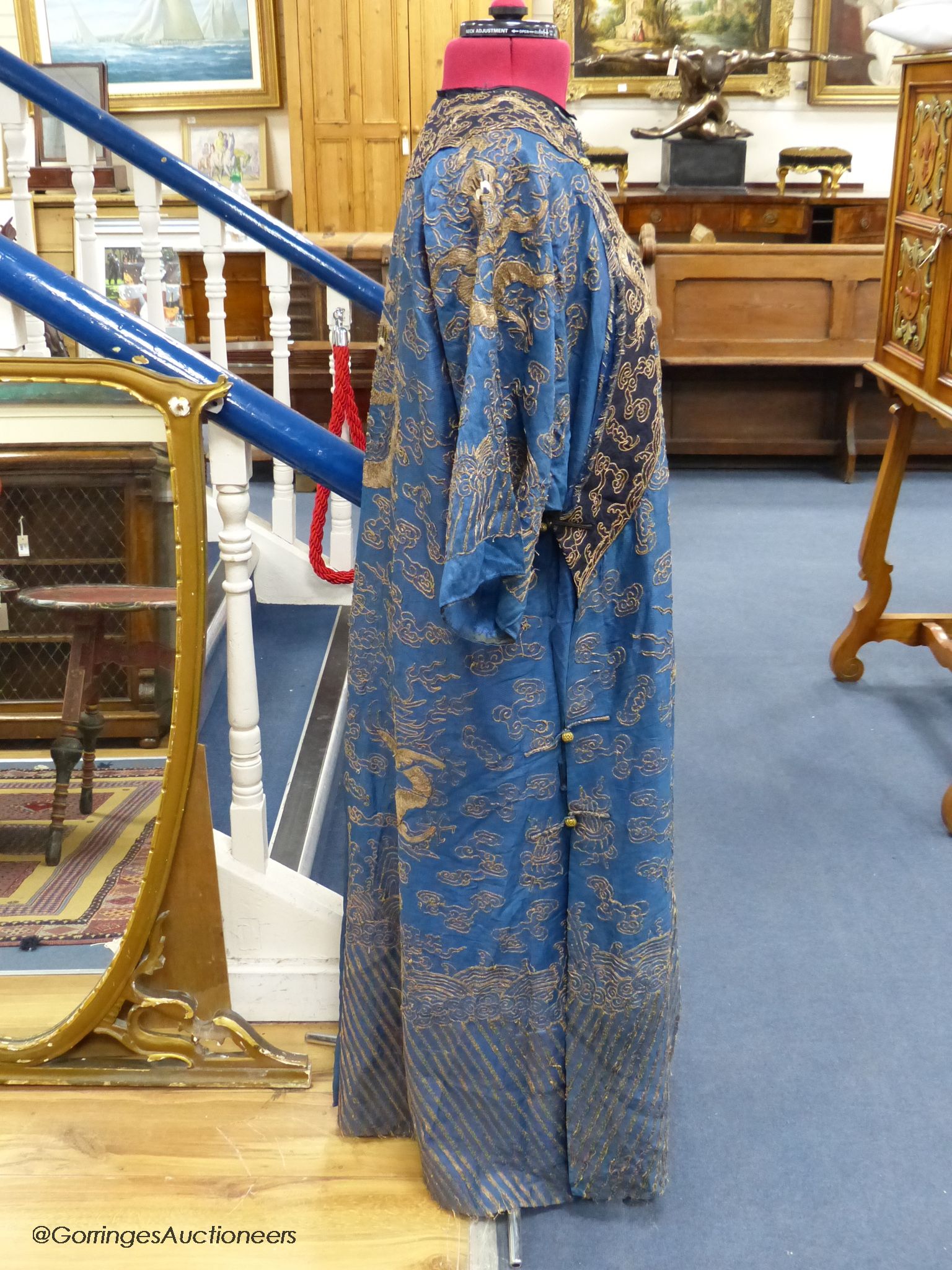 An early 20th century Chinese Summer robe, worked on fine gauze, with gold thread dragon embroidery